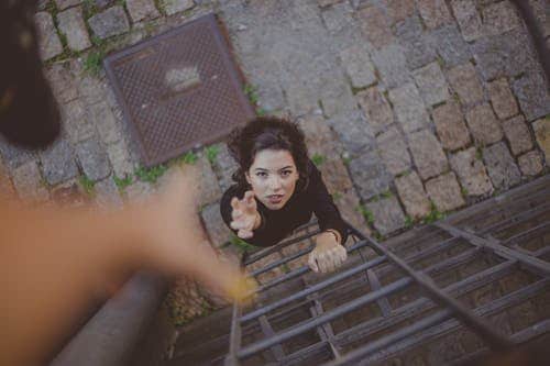 reaching out to her